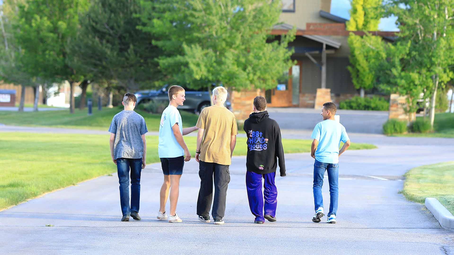 Boys walking in a group on campus